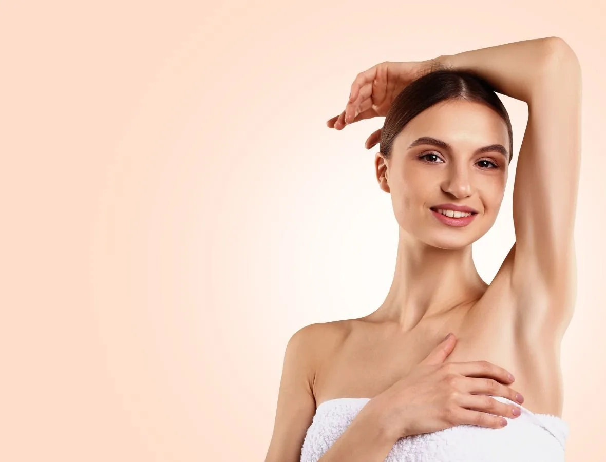 A client with smooth underarm skin after laser hair removal