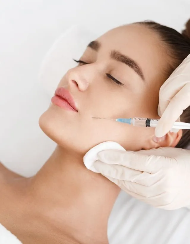 A dermal filler injection along the jawline